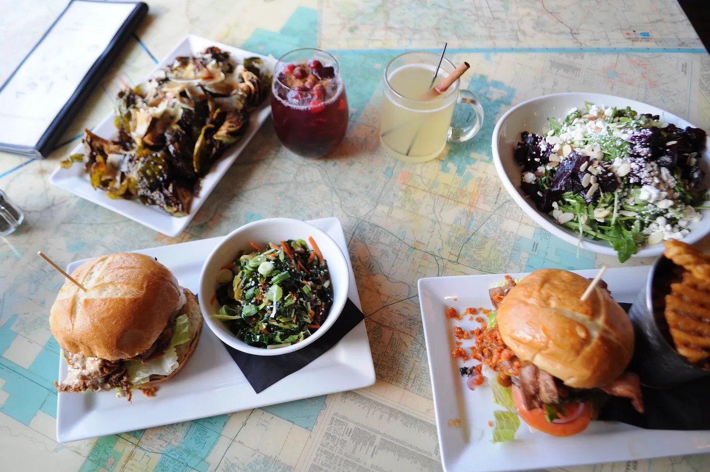 various dishes sitting atop maps