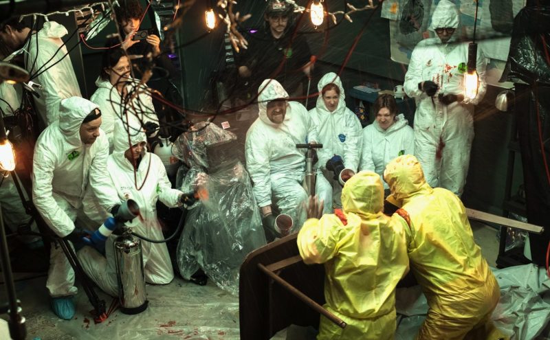 People in hazmat suits on a film set