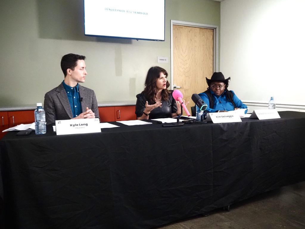 Board Co-Chair Kyle Long, Center on Colfax CEO Kim Salvaggio, and Community Groups Coordinator Terwanda McMoore speaking on a panel during a March 3 press conference ahead of Denver Pride.