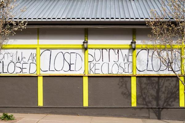 "closed" written on a building