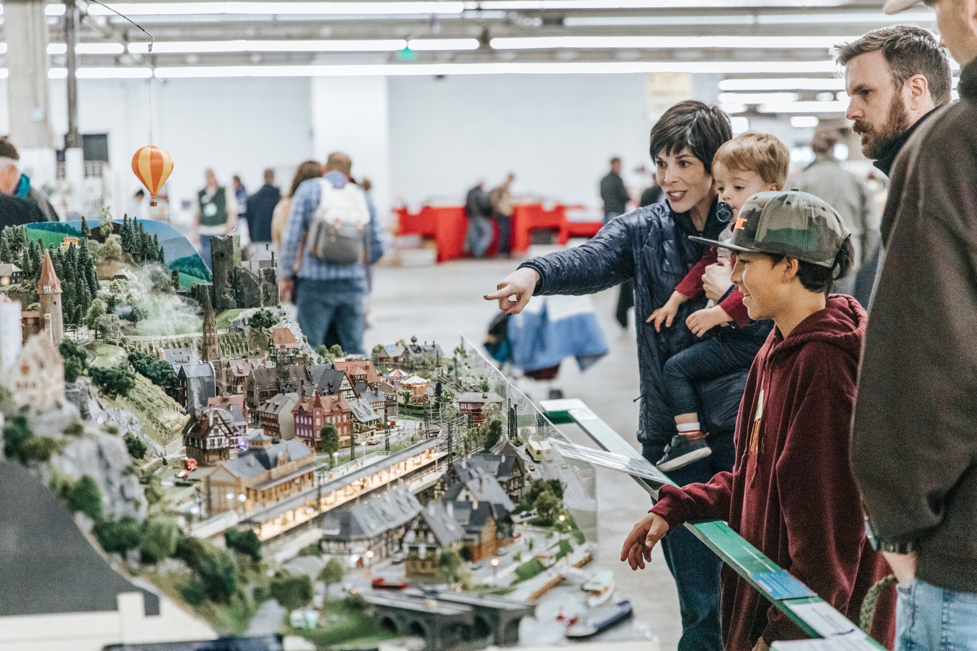 kids look at model trains during the Rocky Mountain Train Show