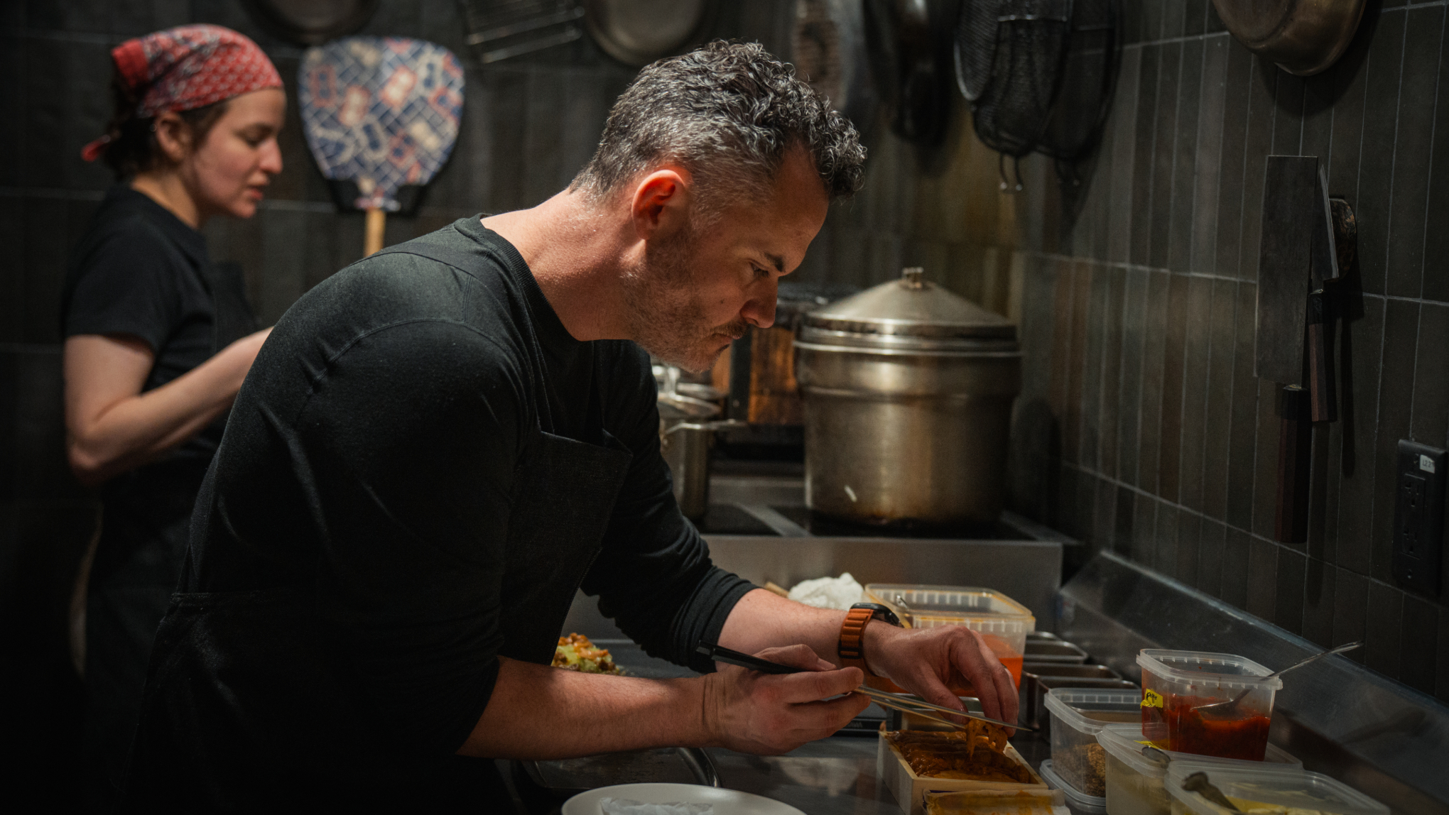 man plating food