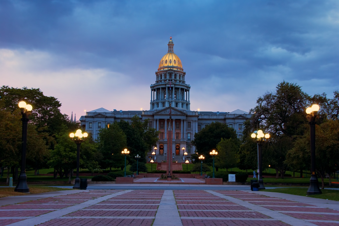 The Colorado State Capitol's golden dome shines during the sunset