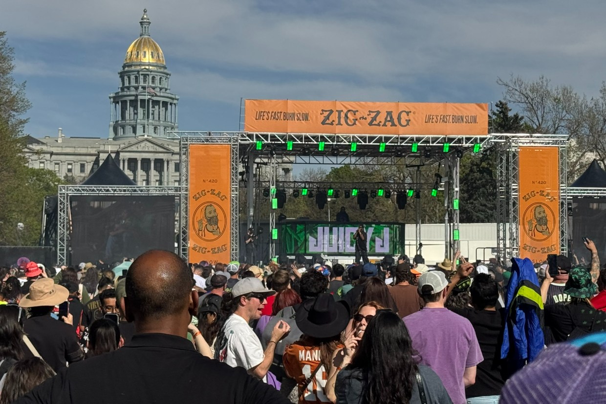 The crowd at the Mile high 420 Fest celebrates in front of the stage on April 20