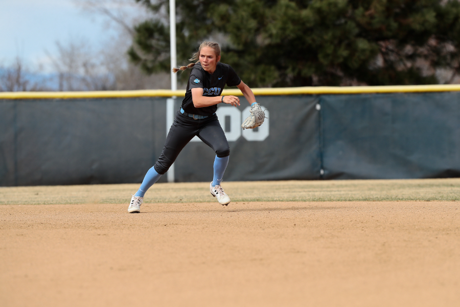 Softball shortstop Peyton Marvel runs toward a ground ball