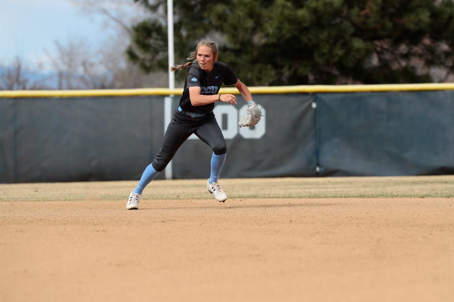Softball shortstop Peyton Marvel runs toward a ground ball