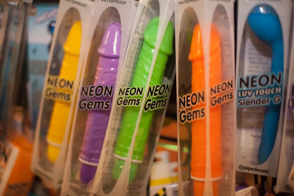 A row of packaged dildos