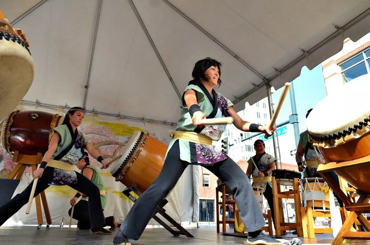 A person with drum sticks