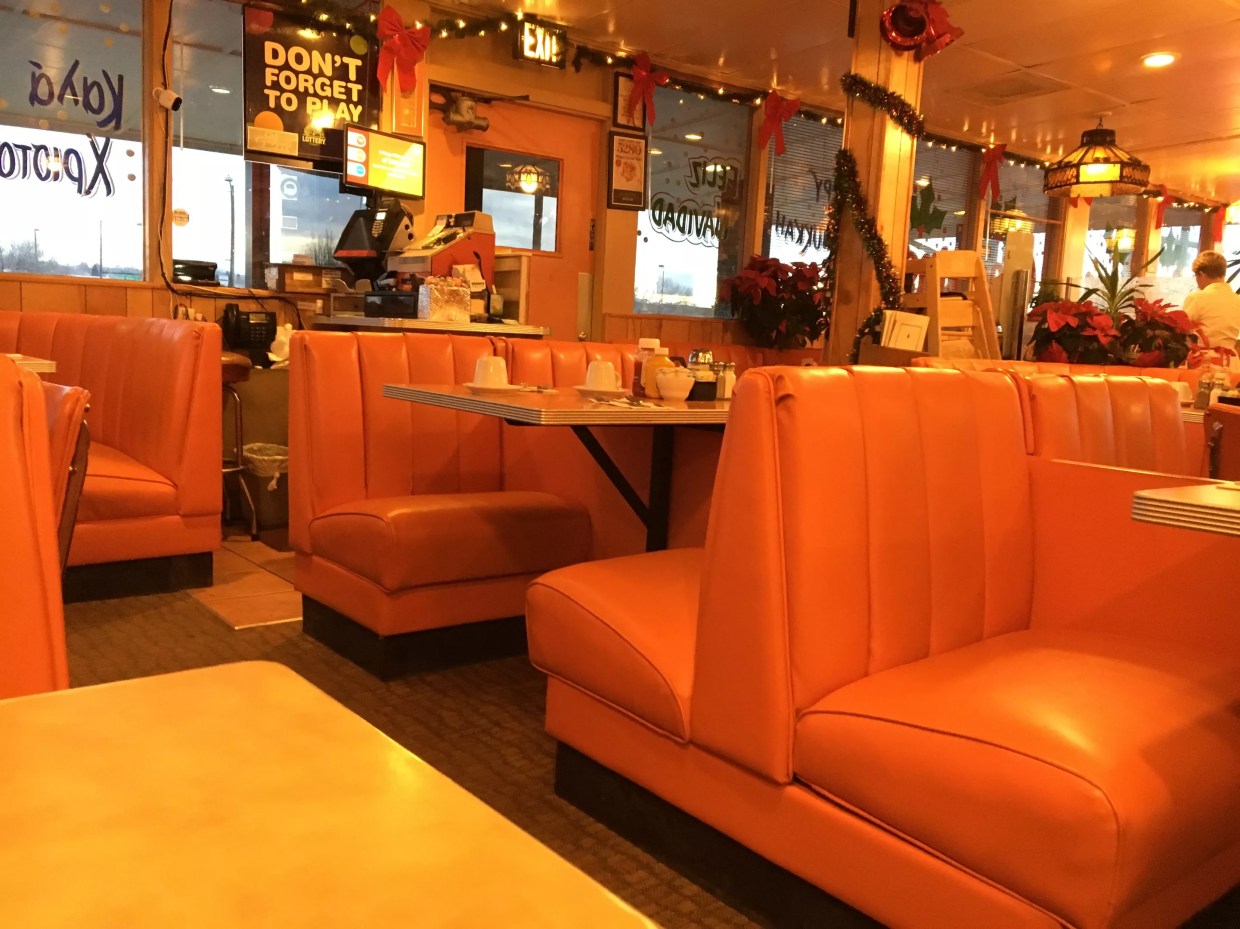 orange booths inside a restaurant