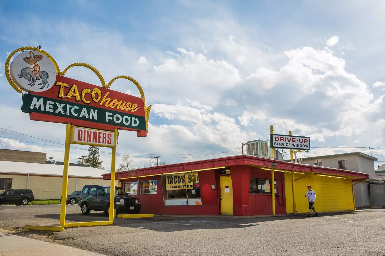 small red and yellow building with a retro sign