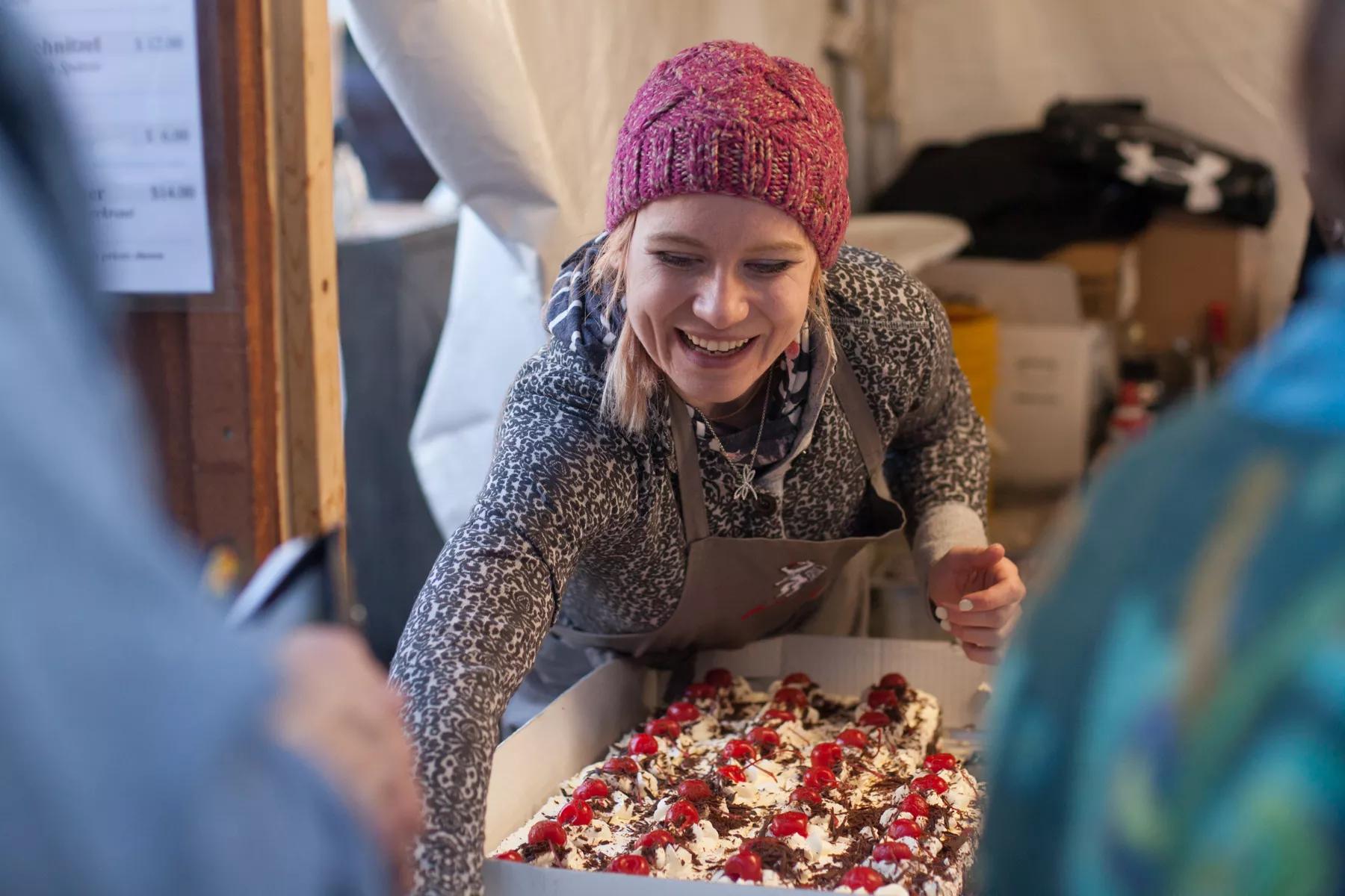 woman with gifts in outside booth
