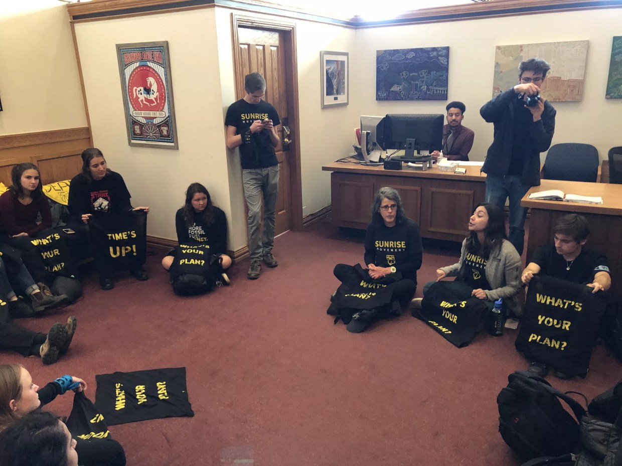 Climate Activists Hold Sit-In at Polis’s Office, Demand Halt to Fracking