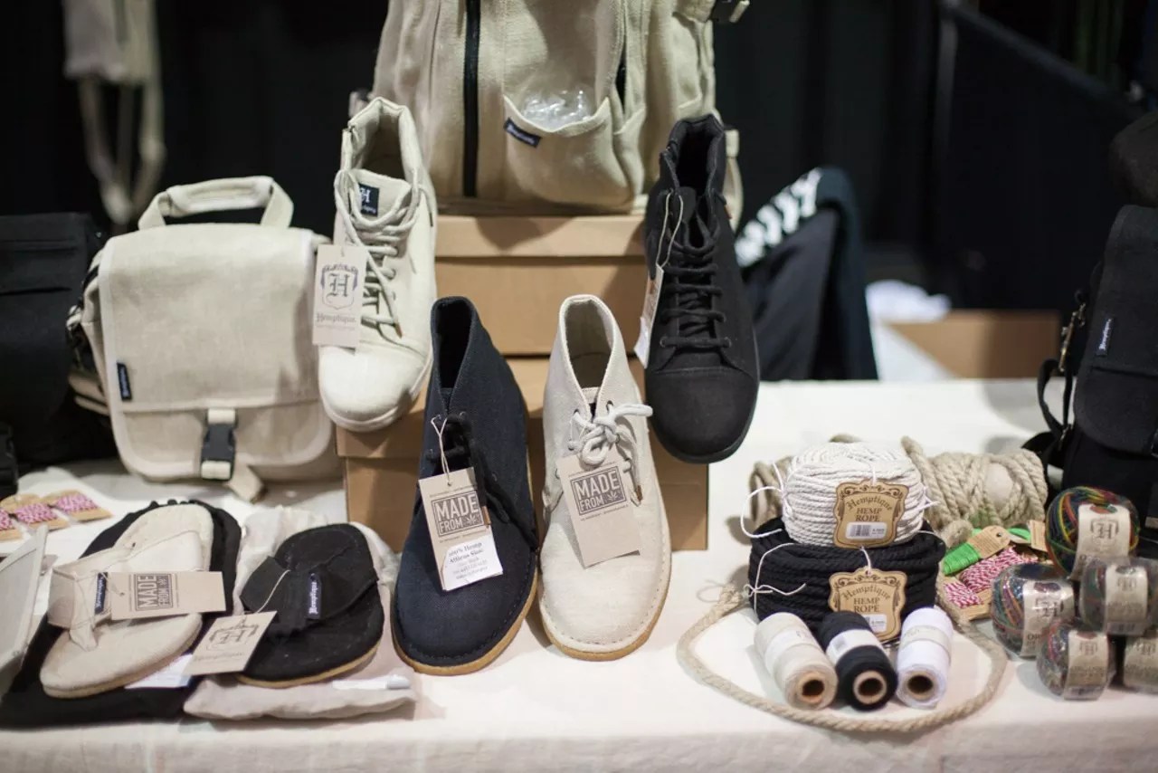 A wide selection of shoes are on display at a store.