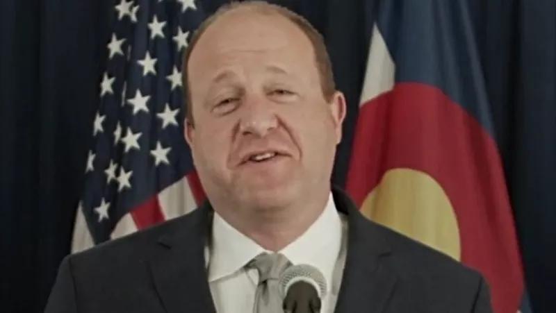 Polis Drops COVID-19 Mask Mandate Like a Hot Rock