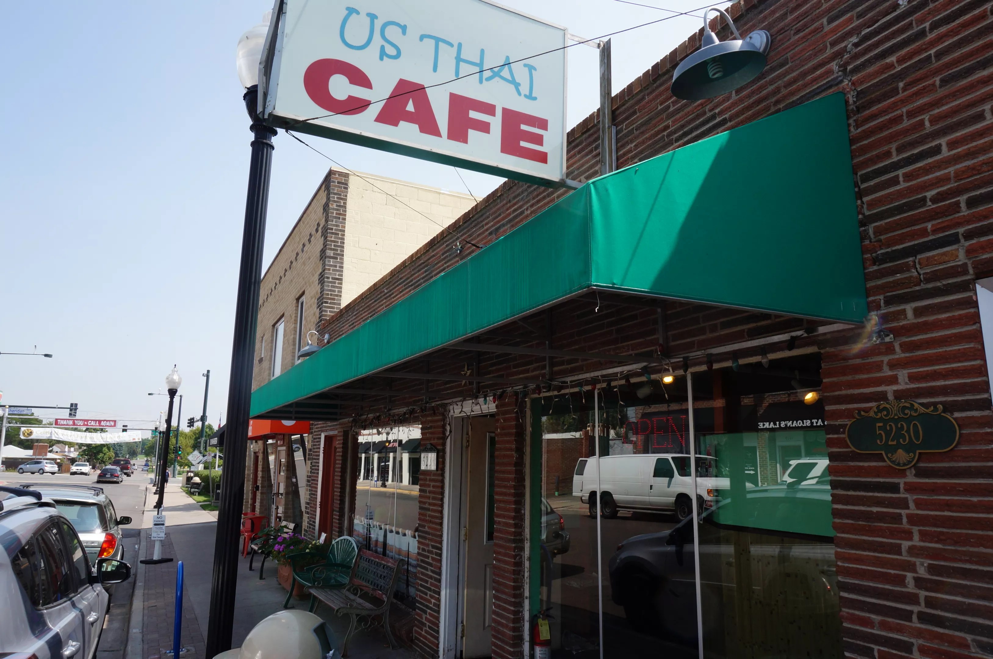 a sign in front of a building