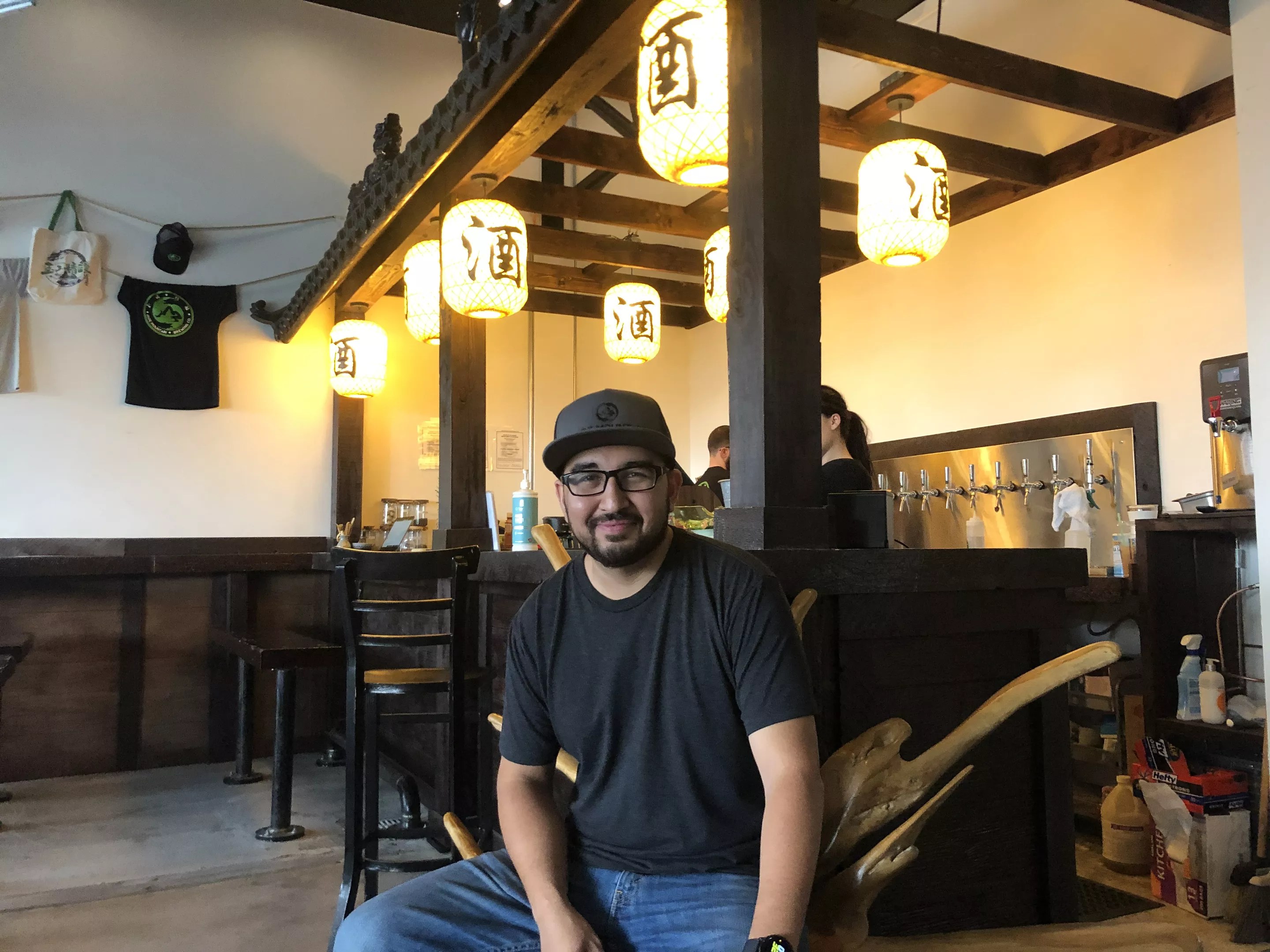 man in black t-shirt inside a brewery