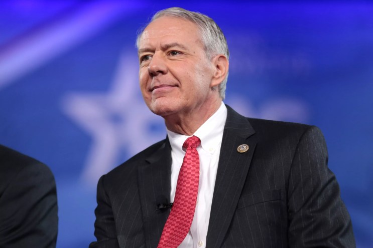 Congressman Ken Buck wearing a suit.