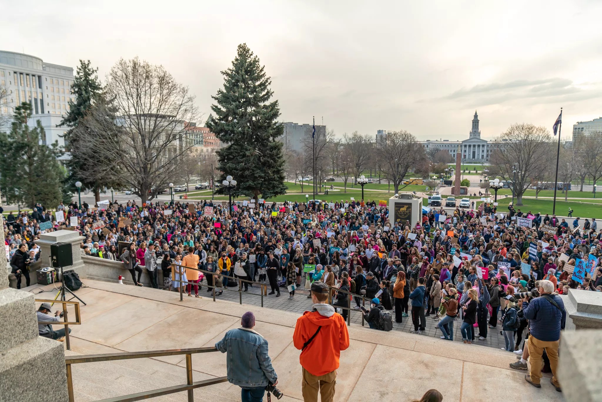 A crowd gathered on the steps of the state capitol building.