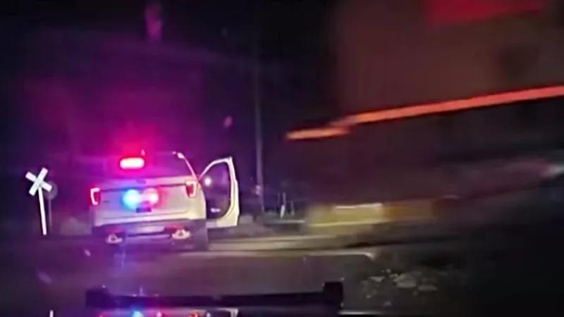 “Oh F*ck”: Two Cops Charged After Cruiser With Suspect Inside Hit by Train