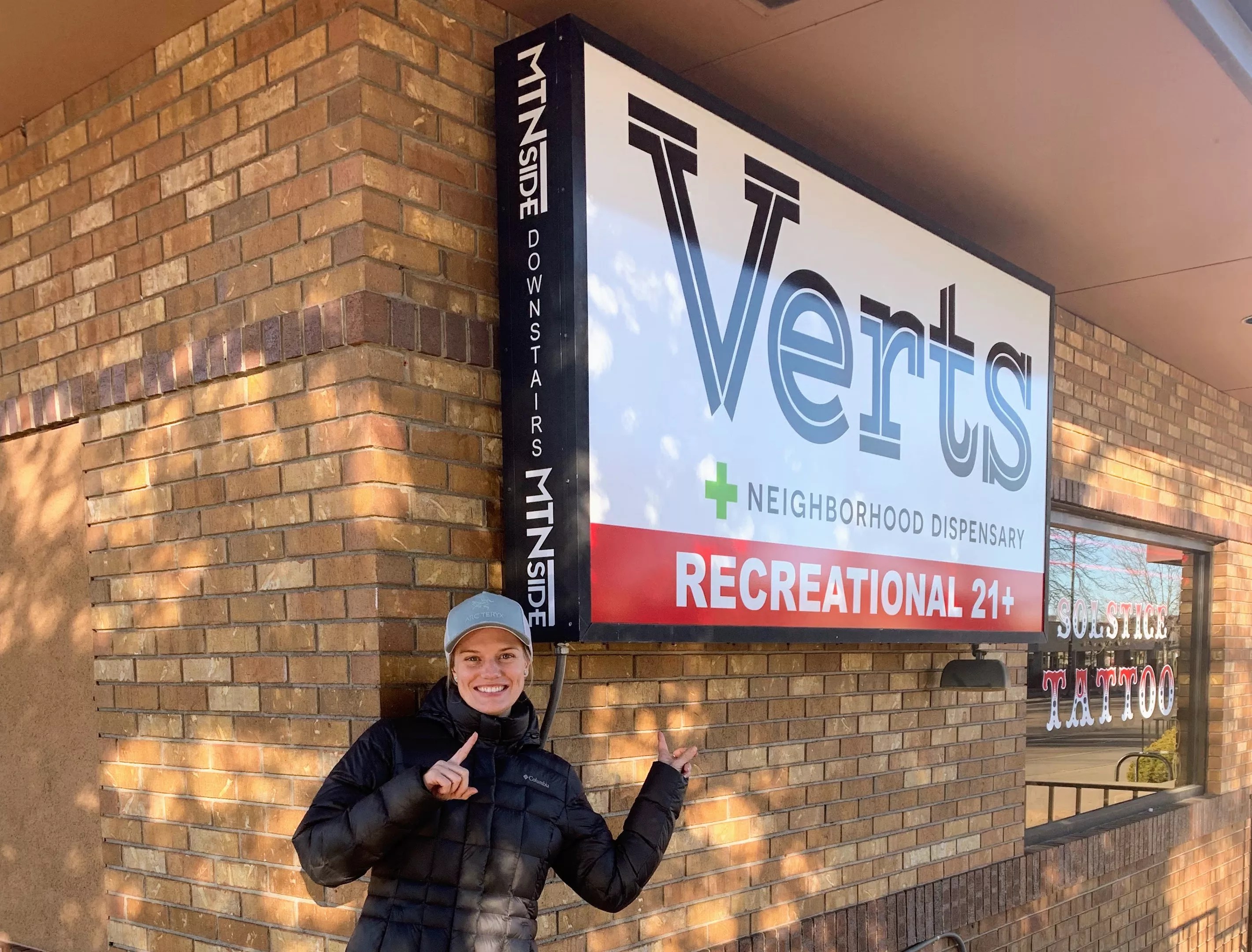Verts Neighborhood Dispensary co-owner Ashley Close in front of her Fort Collins store.