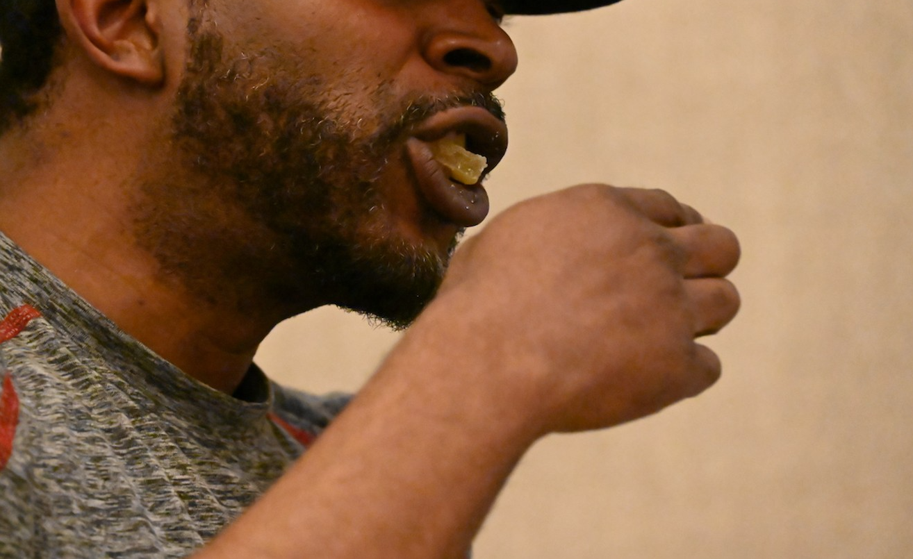 A Denver man eats a marijuana edible during a CDOT event in Colorado.