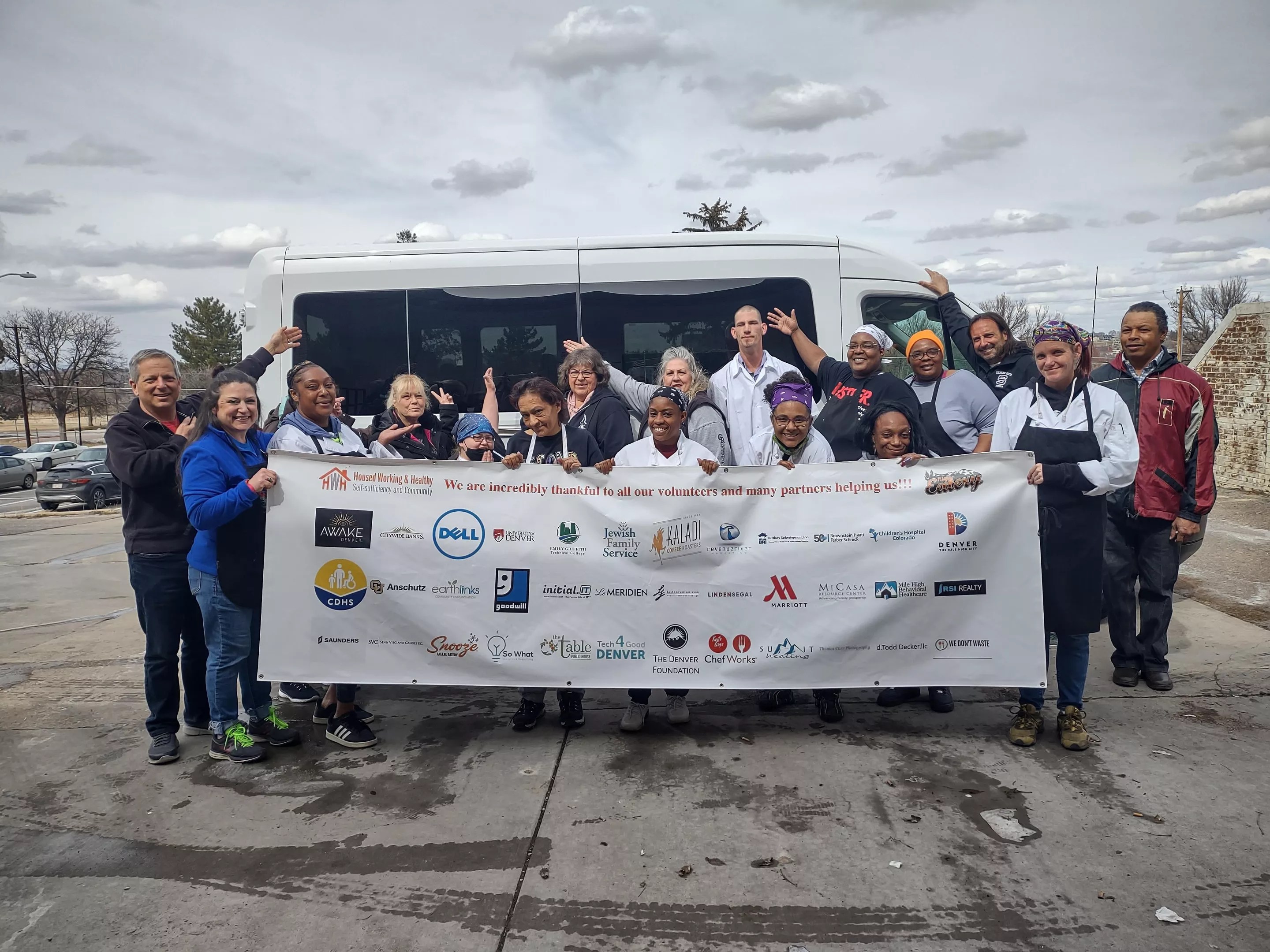 group of people holding banner