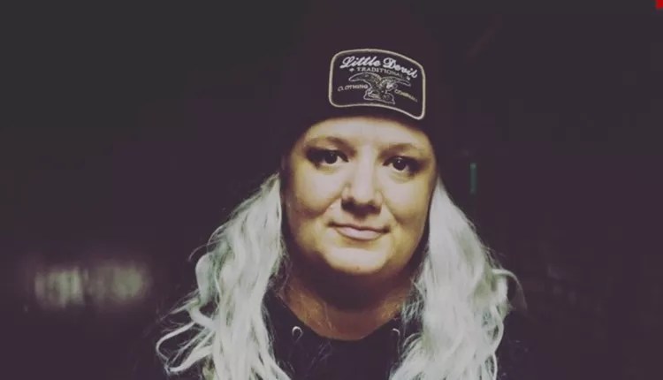 blonde woman wearing black hat