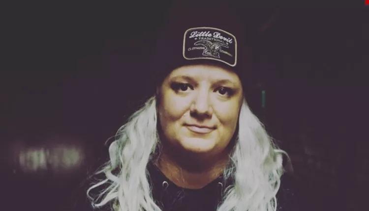 blonde woman wearing black hat
