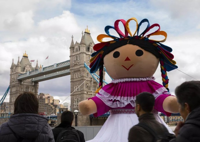 The giant Lele doll at the Tower Bridge in London, England in 2019.