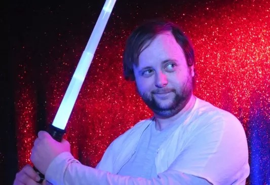 man holding lightsaber