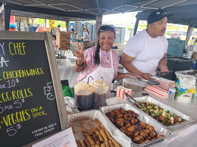 woman and man serving at food fest