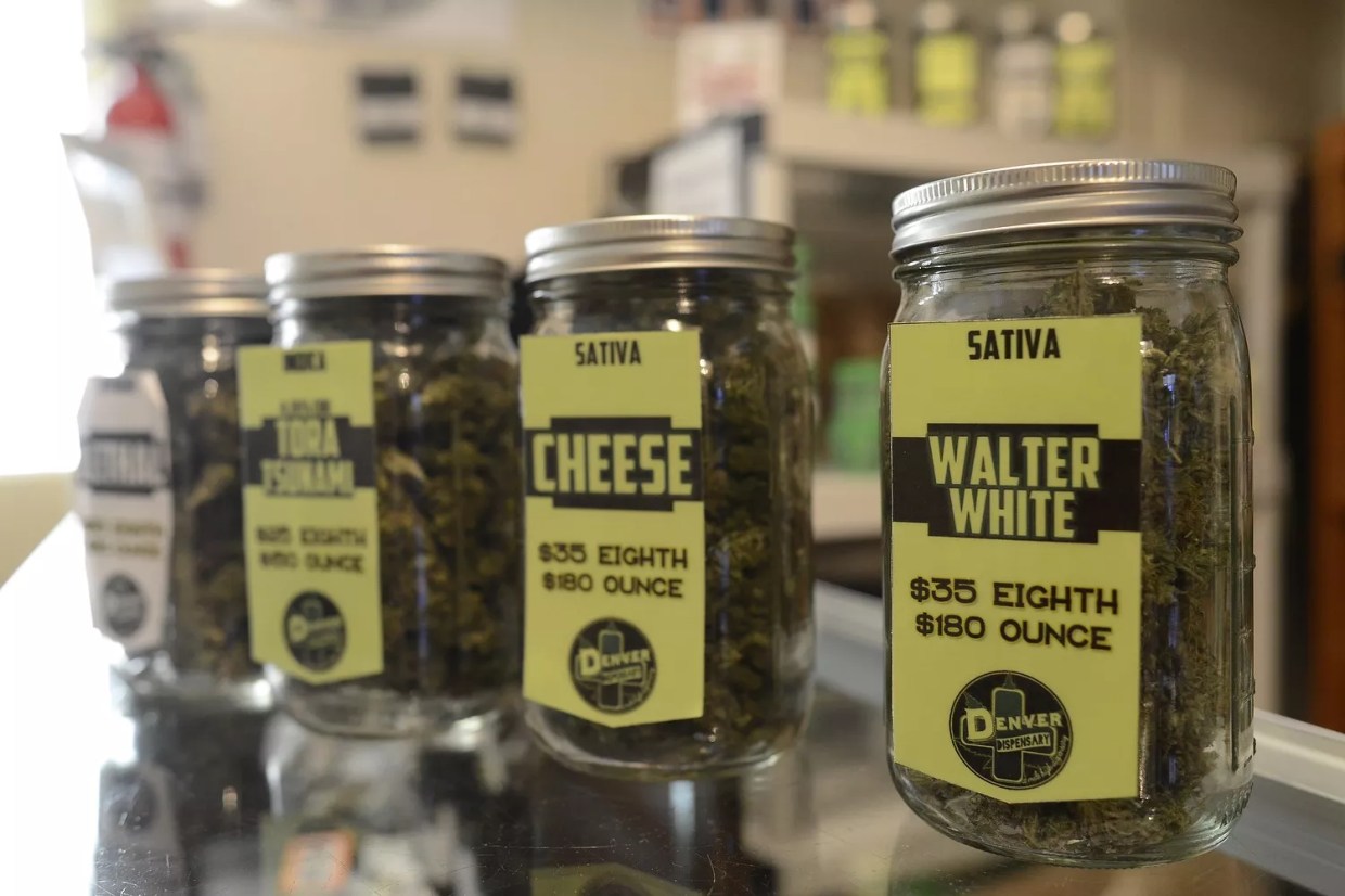 Jars of cannabis flower for sale inside a Denver dispensary
