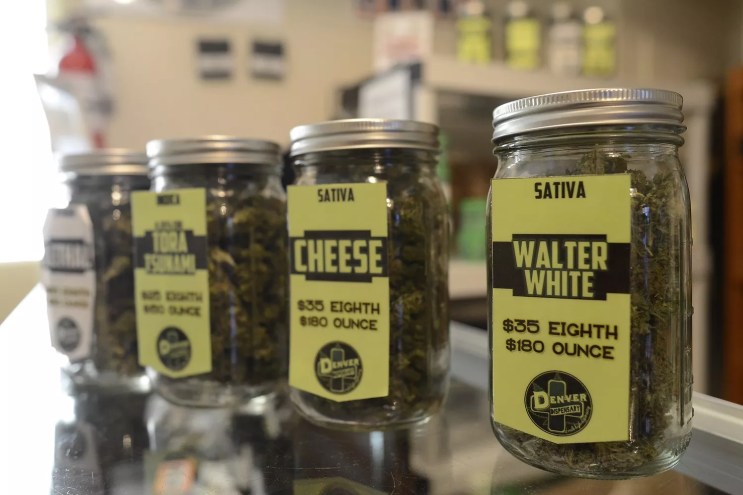 Jars of cannabis flower for sale inside a Denver dispensary