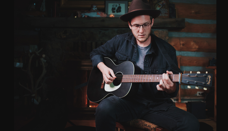 man playing a guitar