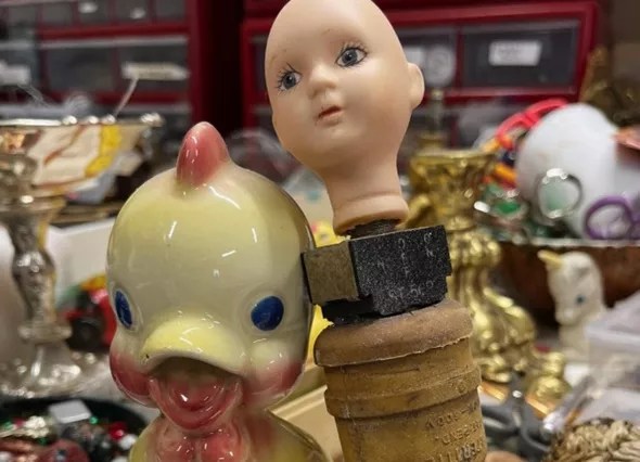 a duck and a plastic baby doll