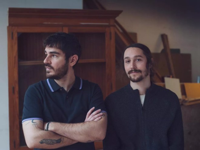 two men in navy shirts