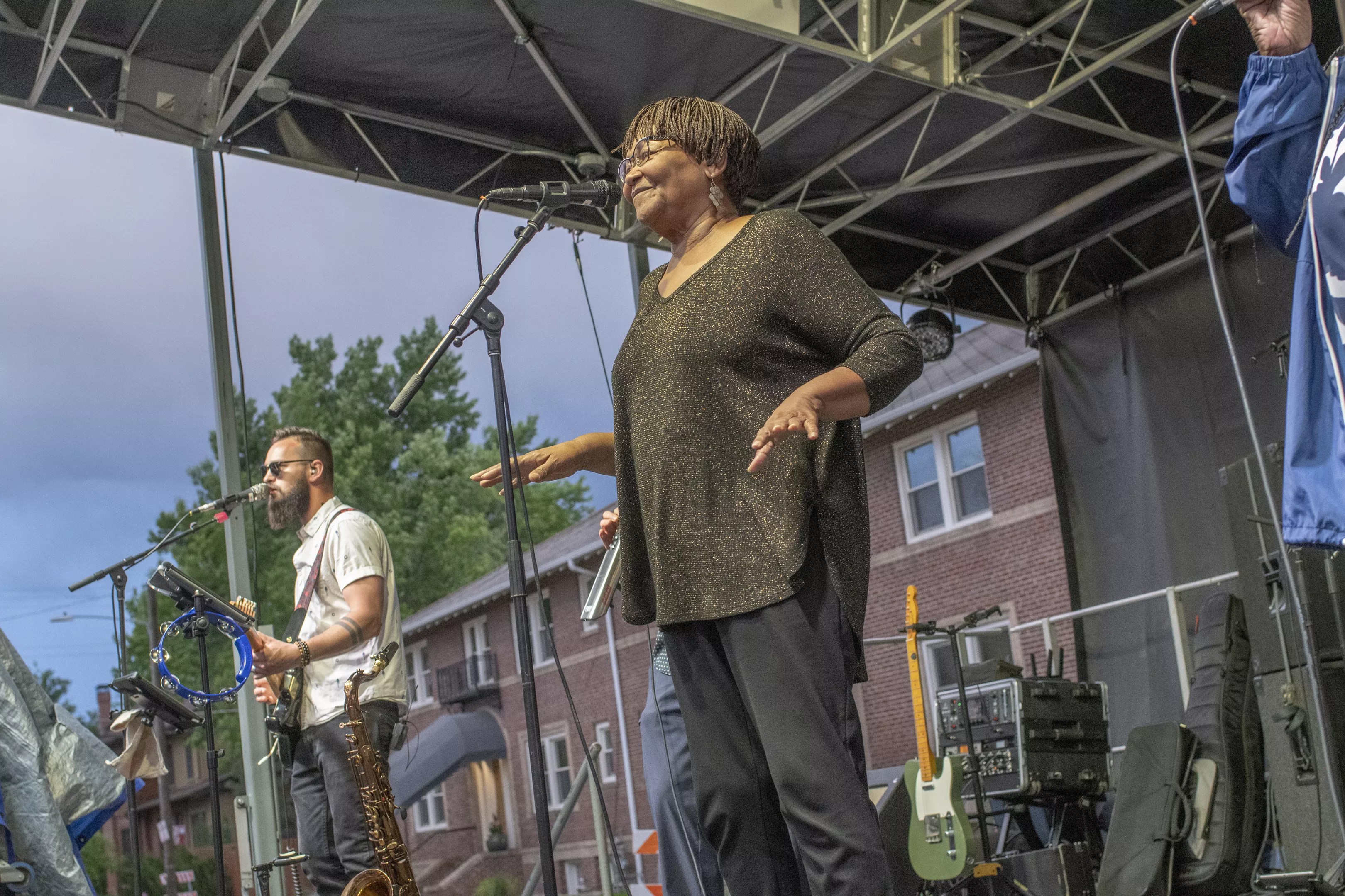 soul singer singing into microphone on stage