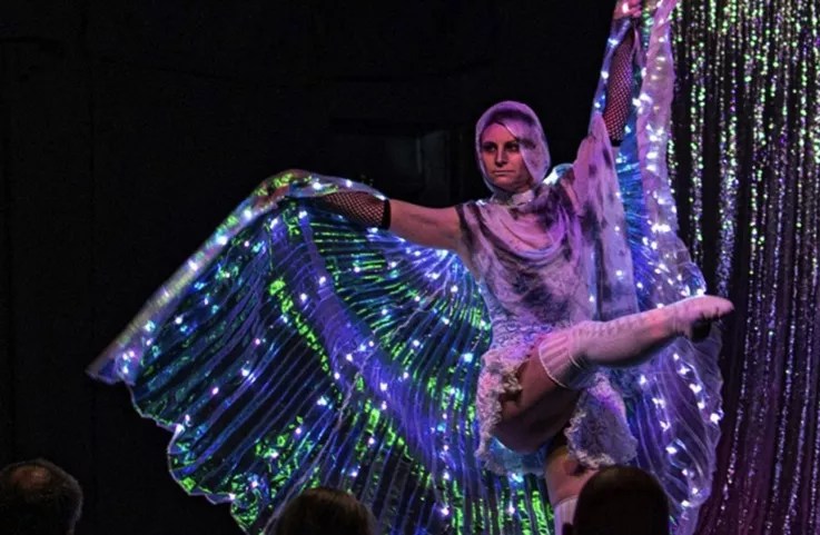 a woman wearing a lightup butterfly outfit