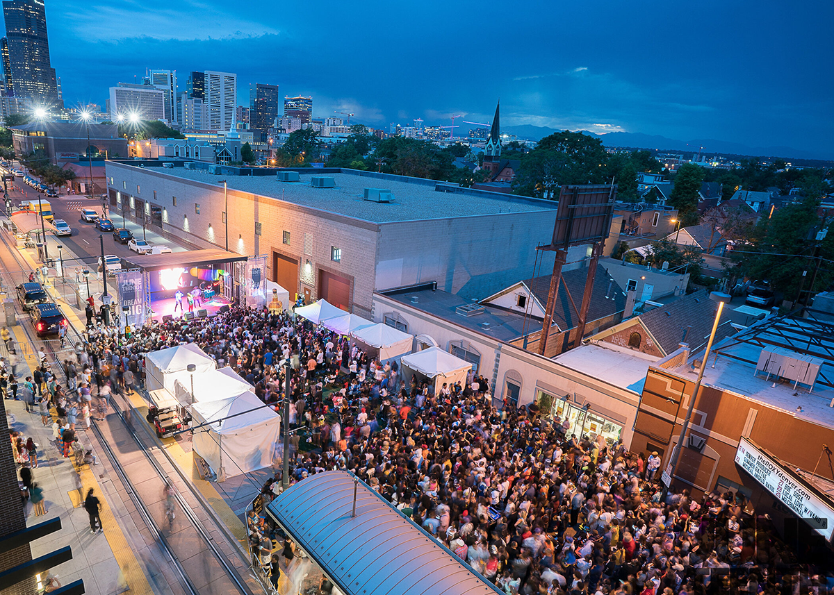 a parade festival takes over a street in Denver