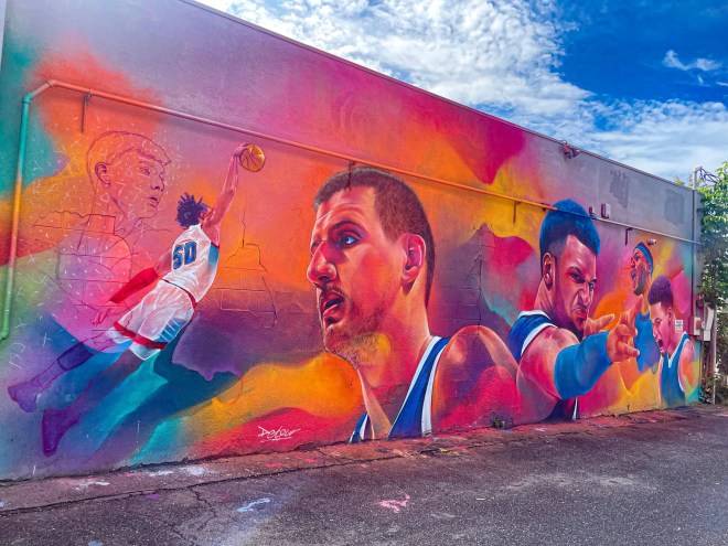 Detour's colorful mural in Denver of Denver Nuggets players Nikola Jokic and Jamal Murray