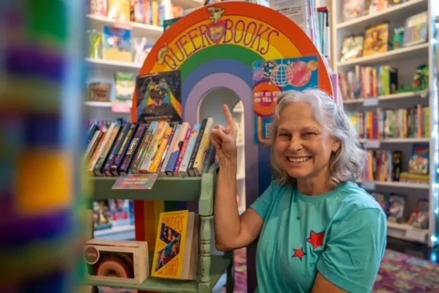 woman smiles in children's book store