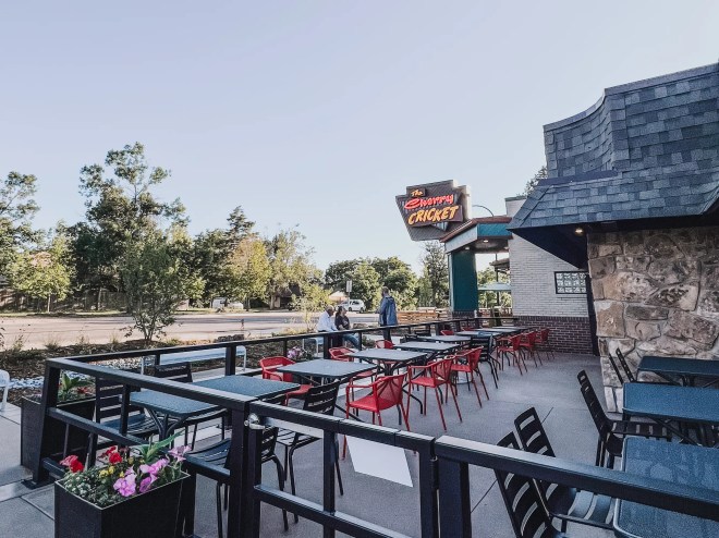a patio set with tables and chairs