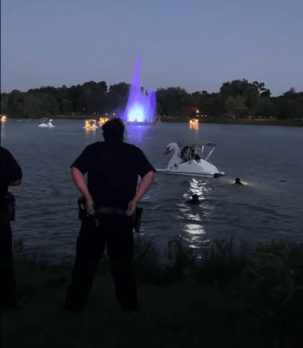 Police in the water during the drowning incident at City Park on Sunday.