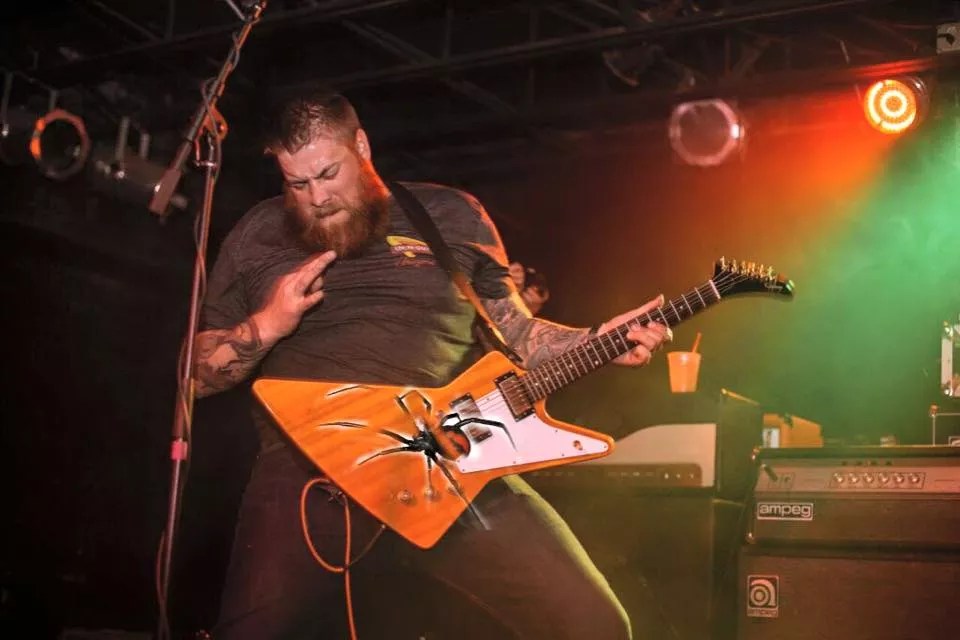 metal guitarist plays on stage