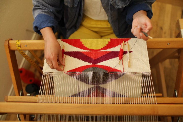 woman at a loom