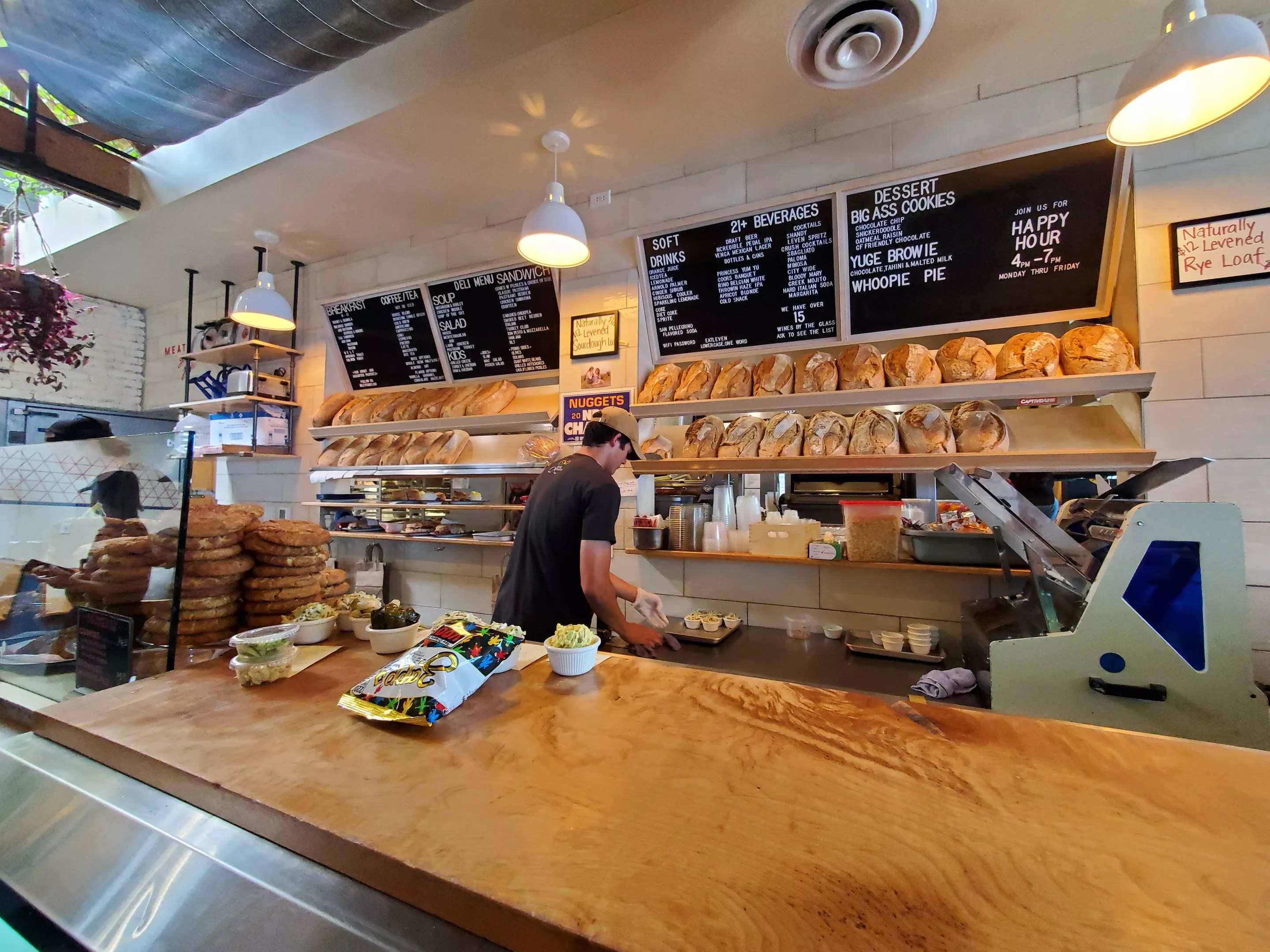 a man behind a deli counter