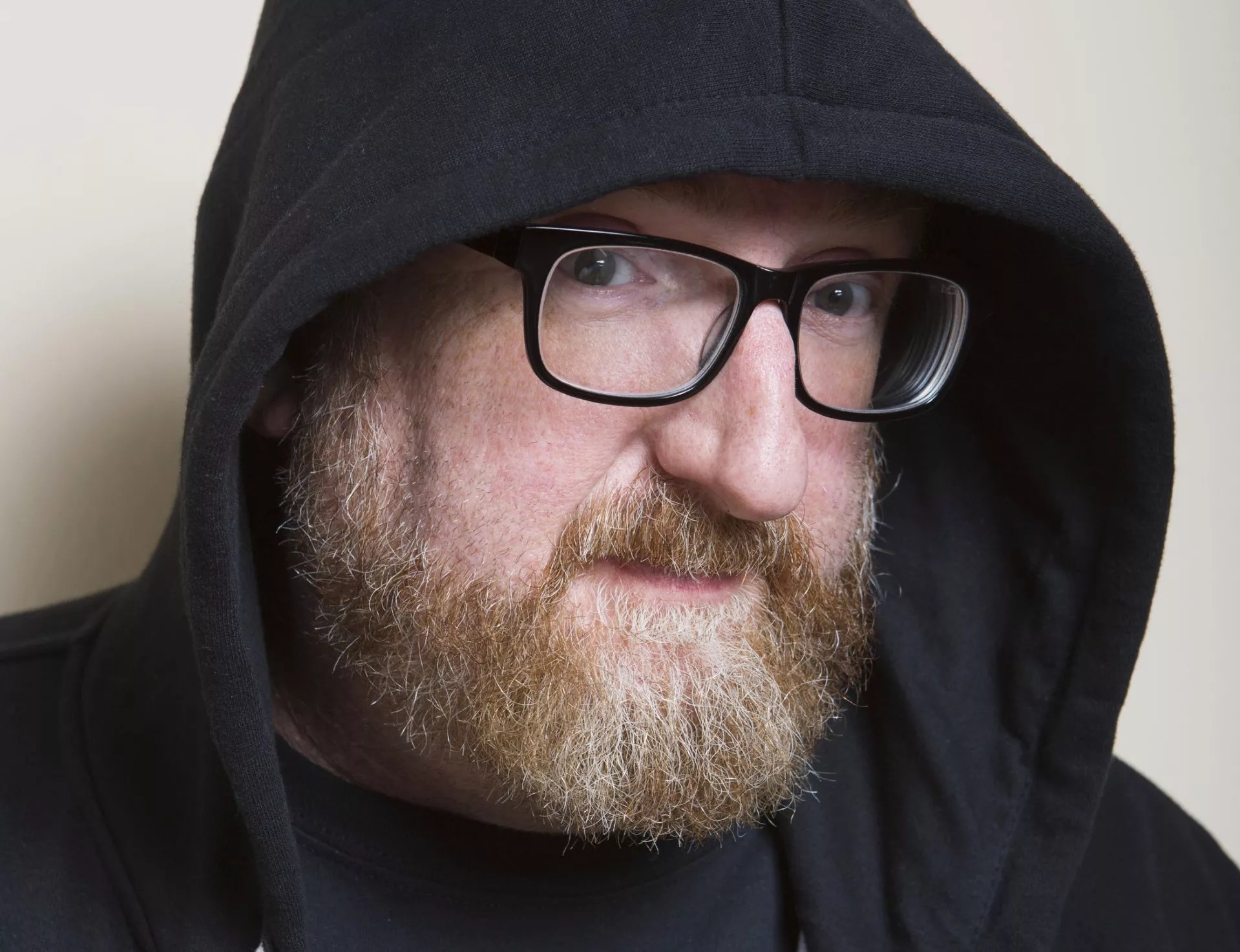 man with beard in hood