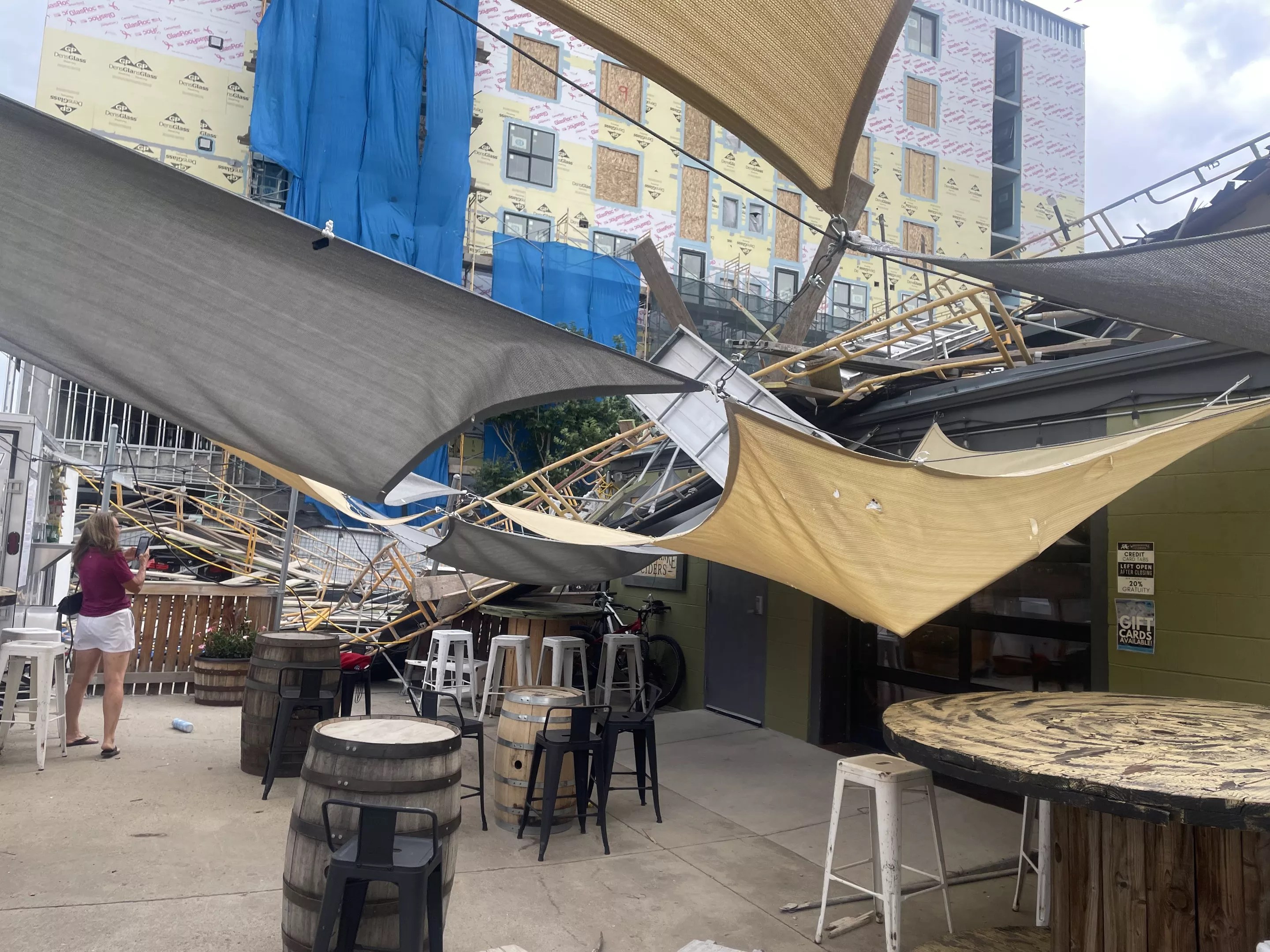 a patio with damage from fallen scaffolding