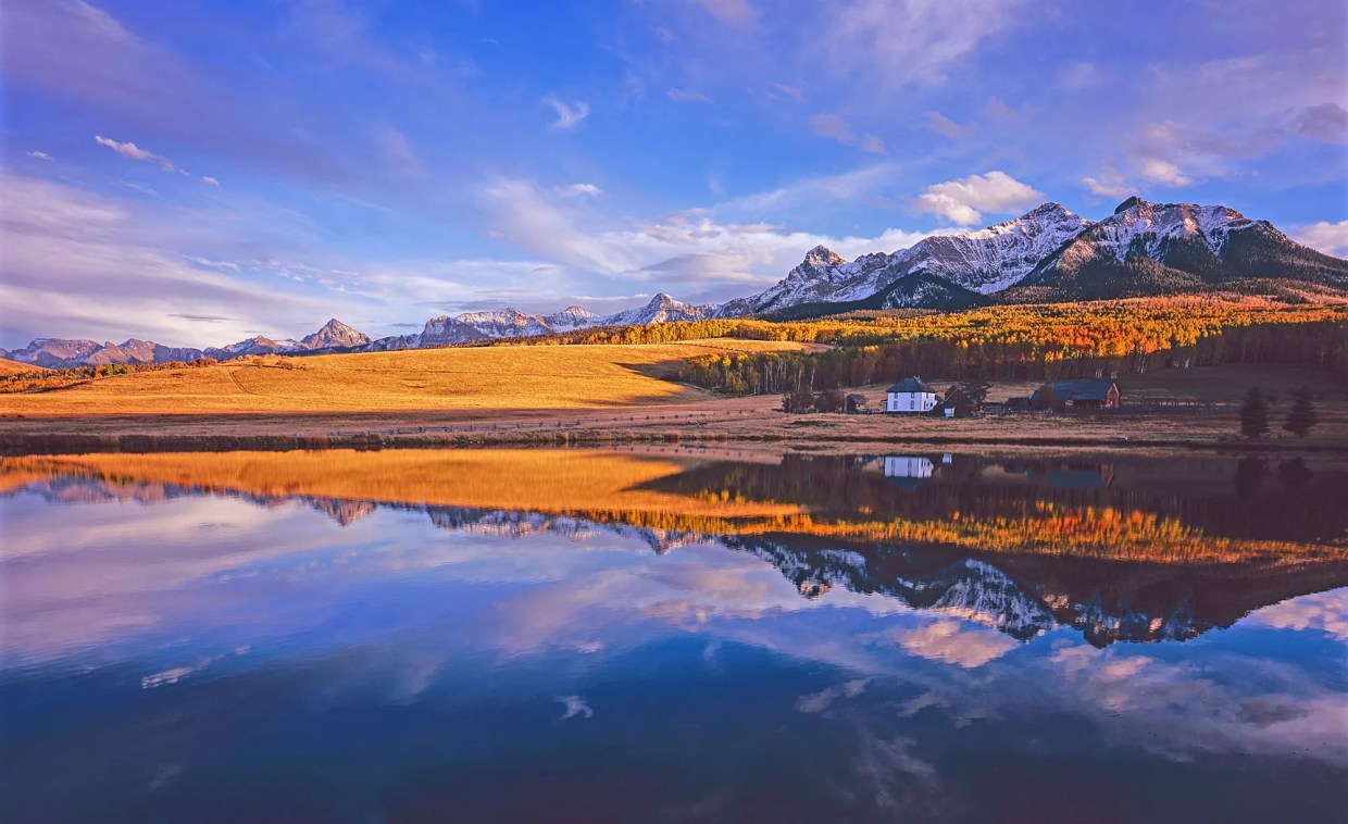 landscape of Colorado ranchouse, lake, sky