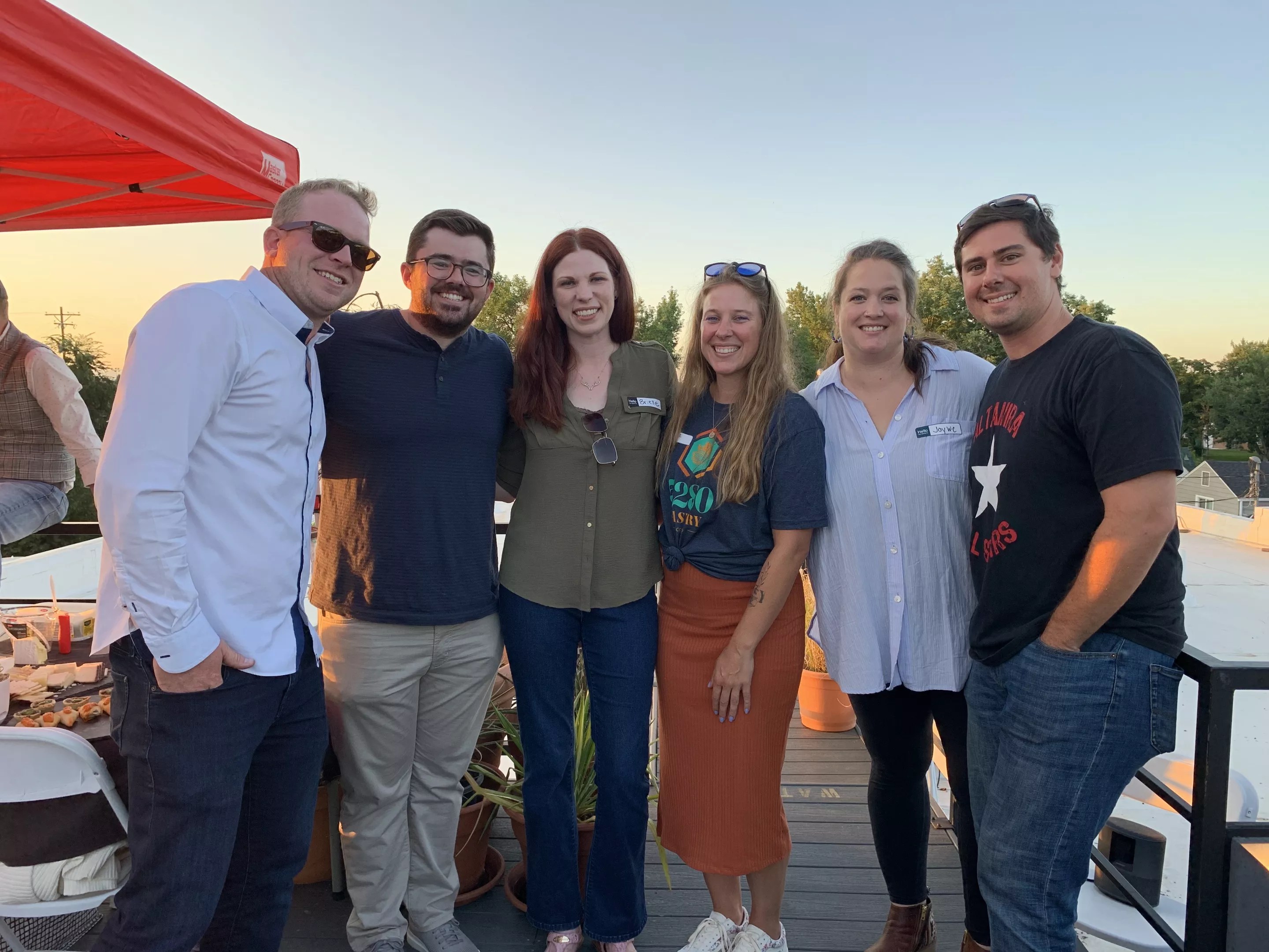 a group of people standing and smiling
